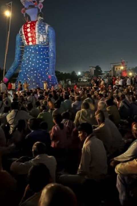 Dussehra crowd gathered before a giant Ravana effigy